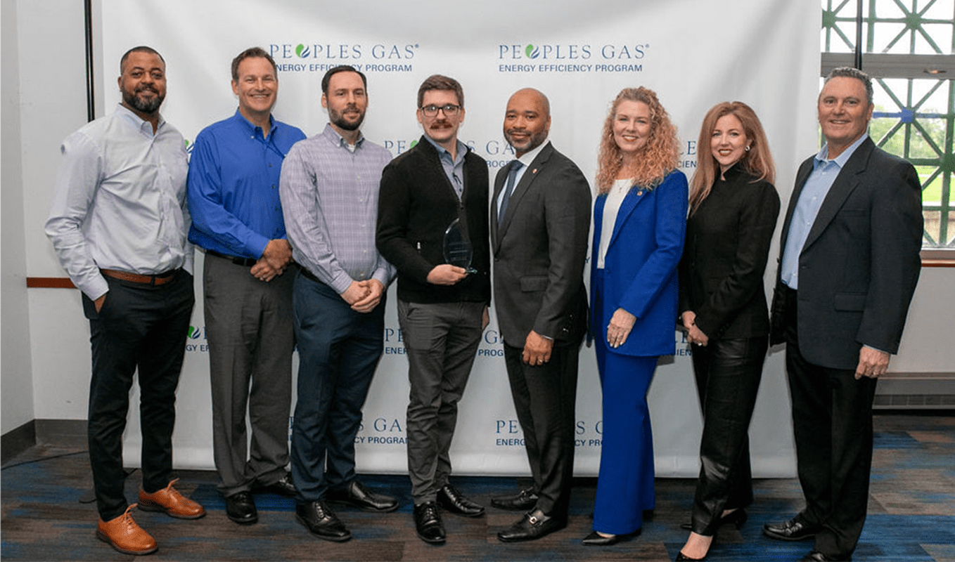 UChicago Energy Services team with their award from Peoples Gas